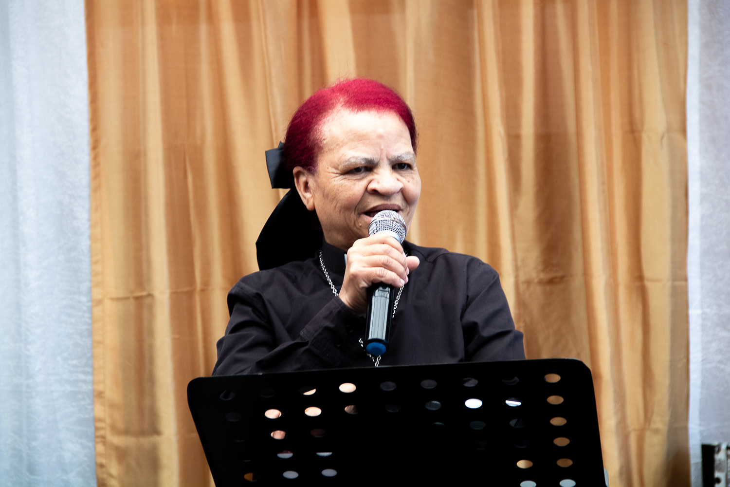 Pastor L. van Rooyen preaching at the pulpit